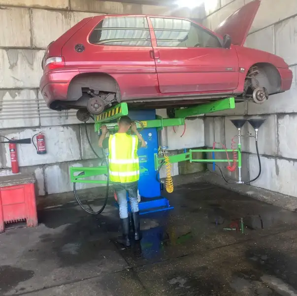 Richard depolluting an End of Life vehicle. Richard depolluting an End of Life vehicle.: Swipe To View More Images